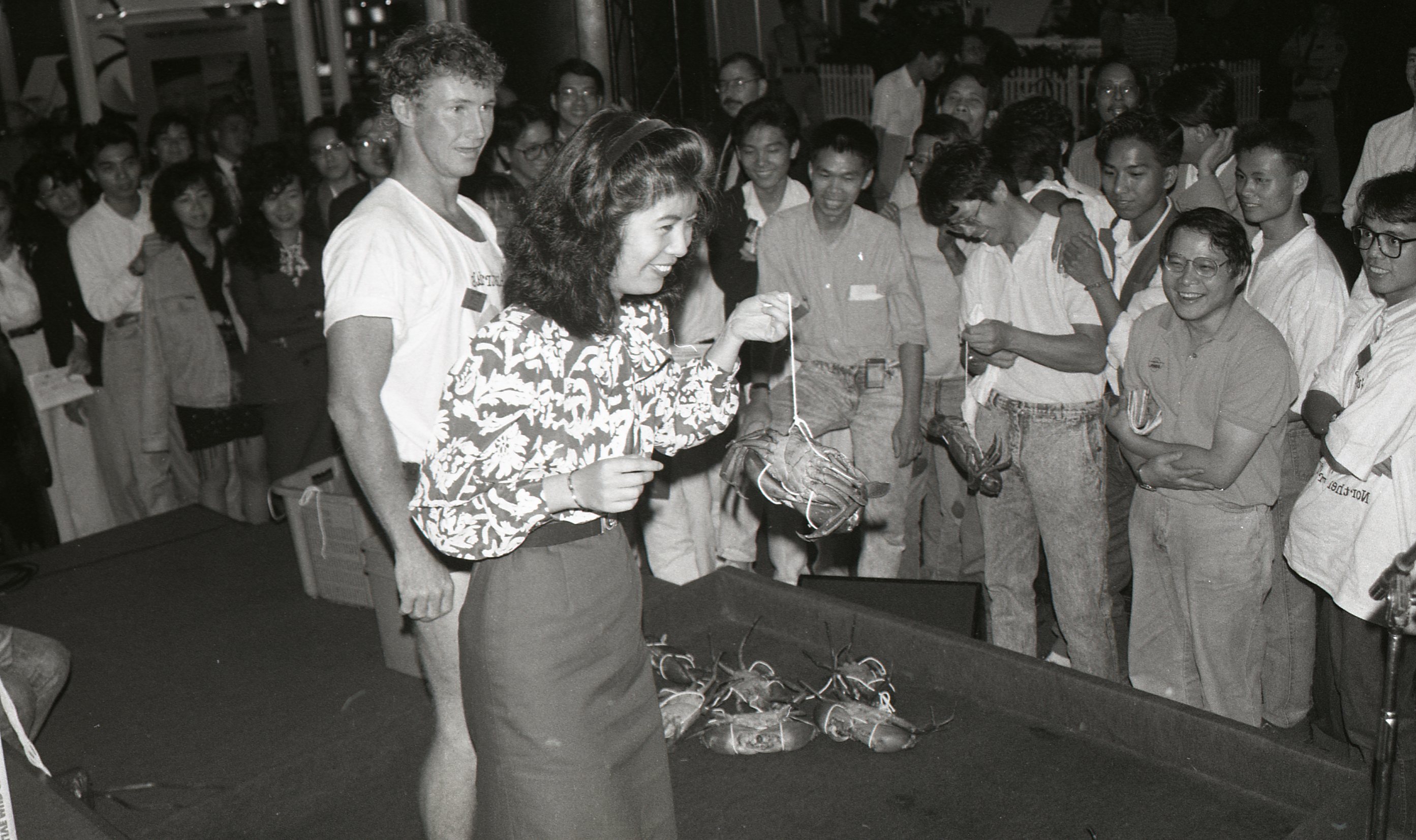 Hong Kong World Expo, Northern Territory delegation Mud Crab Tying demonstration, October 1989<br />Image courtesy of Library & Archives NT,  Department of the Chief Minister, NTRS 3823 P1, Box 11, BW2876, Image 30